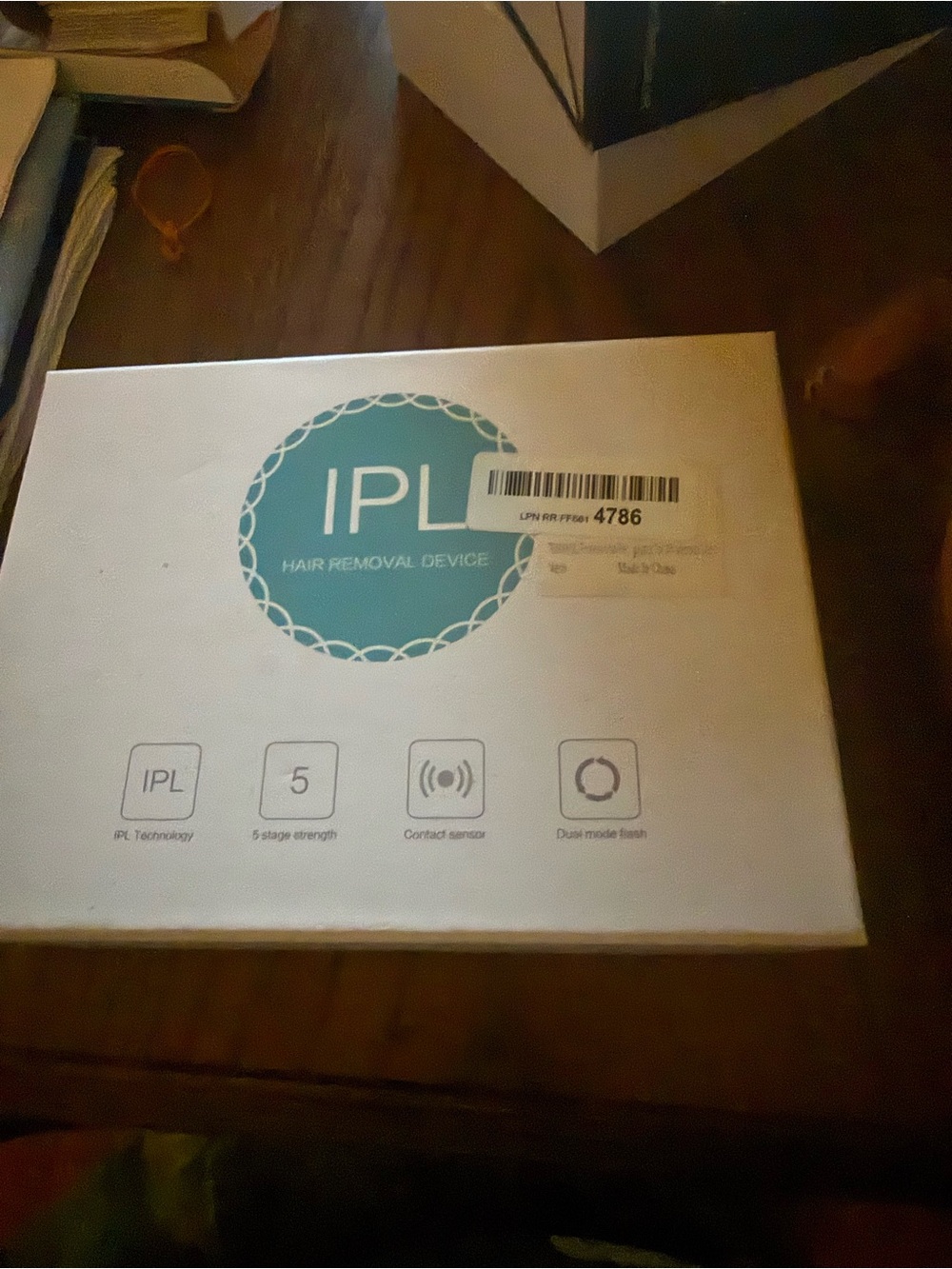 IPL Hair Removal Device - White with Teal Logo